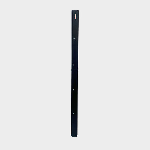 Angled view of the aluminium wheel arch shelf showing its matte black finish and low profile