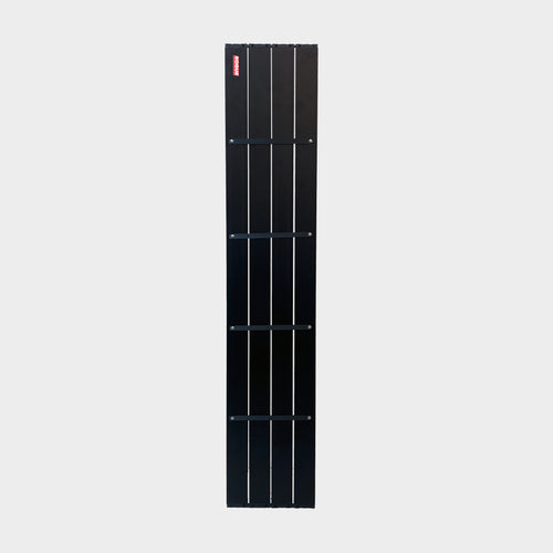 Close-up of the aluminium wheel arch shelf showing its matte black finish and slat construction