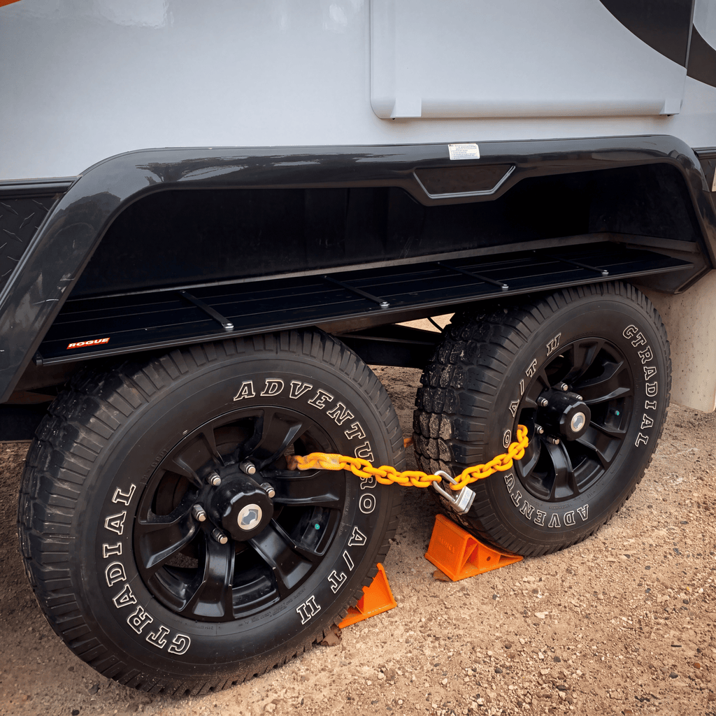 The wheel arch shelf loaded with gear at a campsite