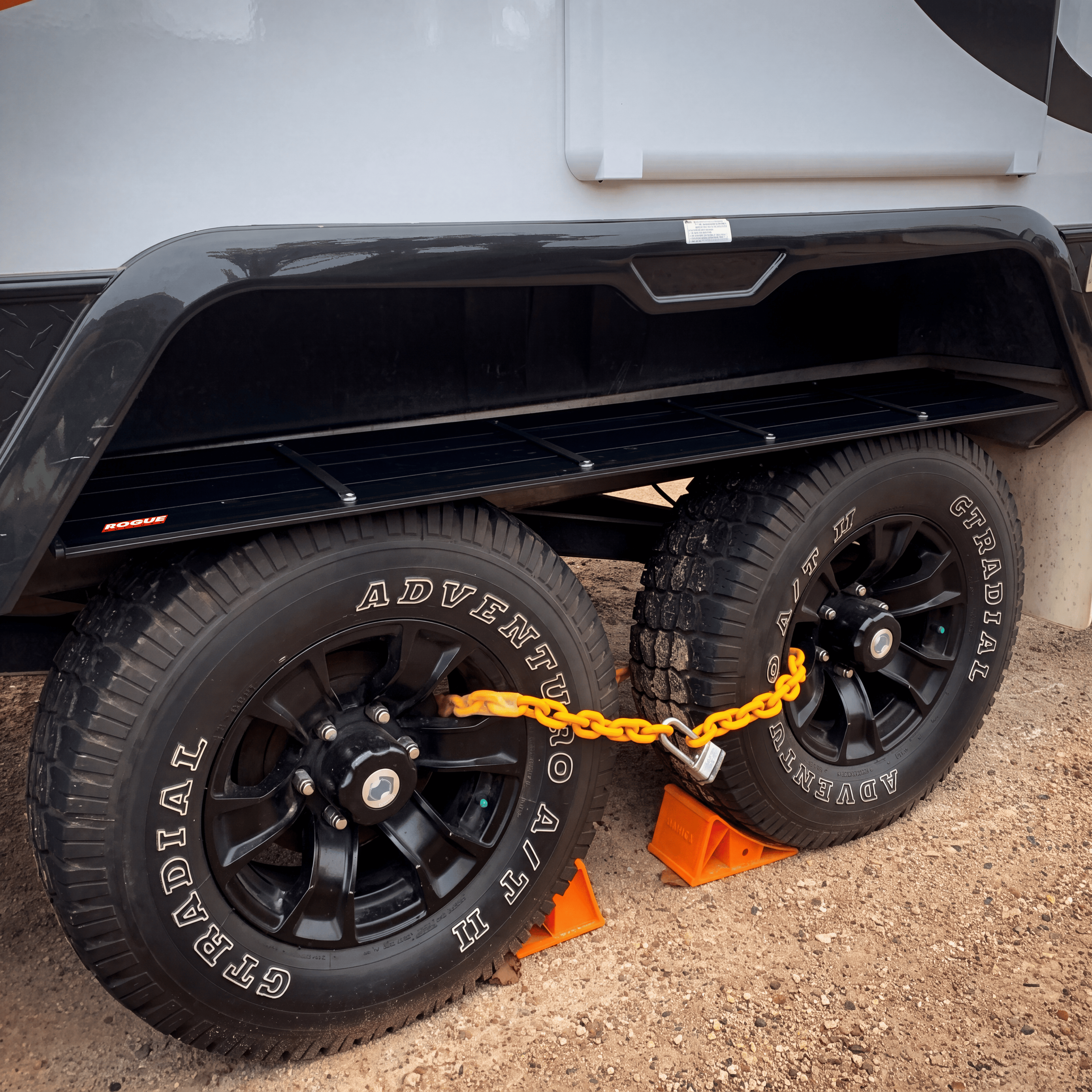 The wheel arch shelf loaded with gear at a campsite